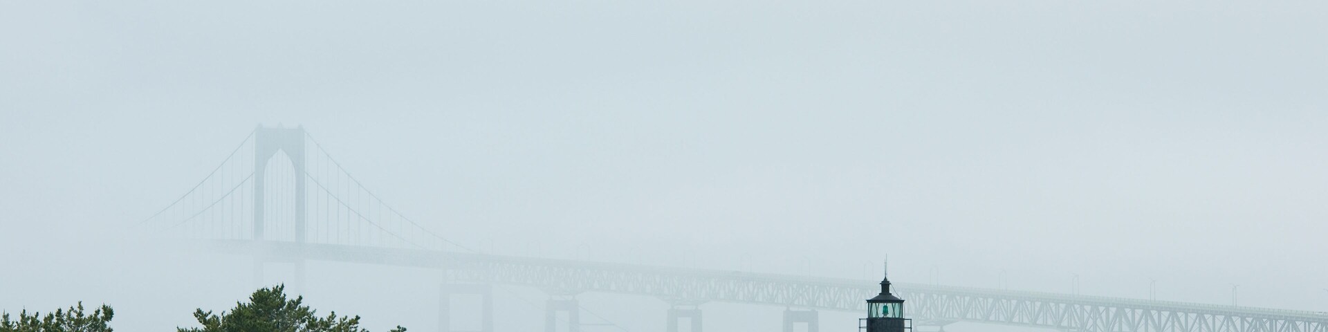 Looking from the Goat Island Causeway across Goat Island to the Jamestown Bridge in the fog.