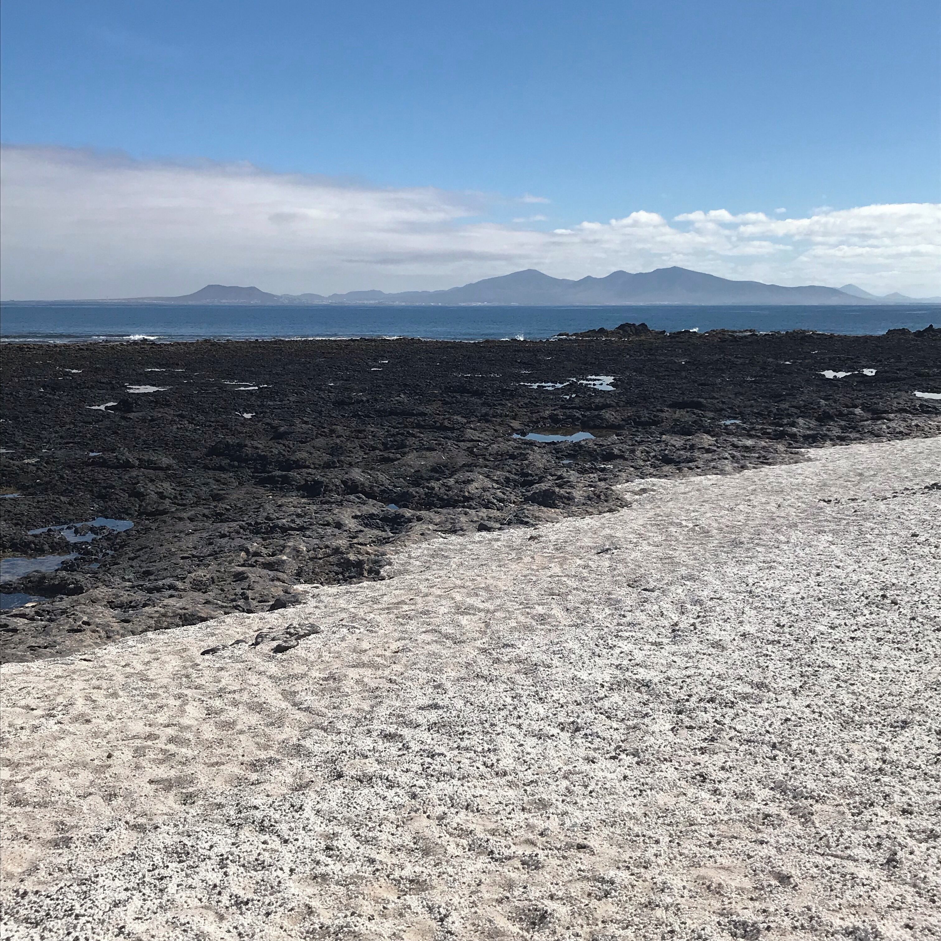 This amazing beach has lots of skeletal calcium carbonate remains of Rhodoliths which is the white ‘stone’. It gives the appearance of popcorn which also gives the beach its name. The island in the distance is Lanzarote.