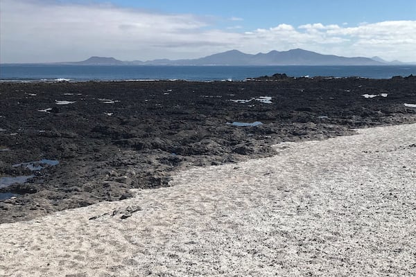 This amazing beach has lots of skeletal calcium carbonate remains of Rhodoliths which is the white ‘stone’. It gives the appearance of popcorn which also gives the beach its name. The island in the distance is Lanzarote.