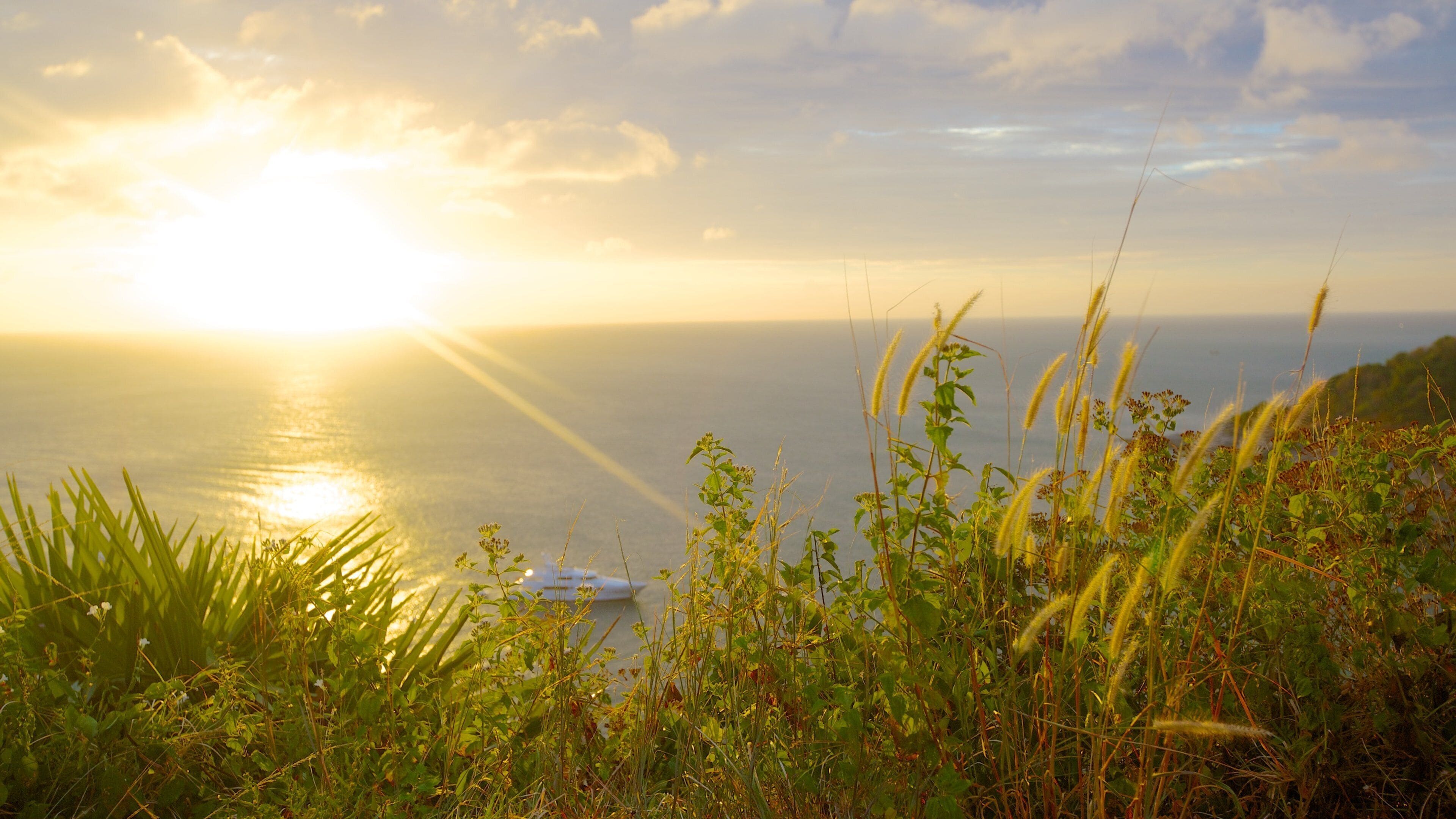 Promthep Cape which includes tropical scenes, a sunset and general coastal views