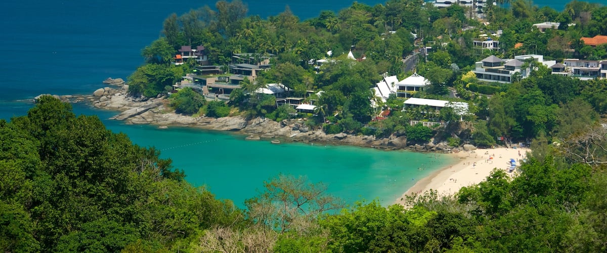 Phuket - Phang Nga showing a sandy beach, rugged coastline and a coastal town
