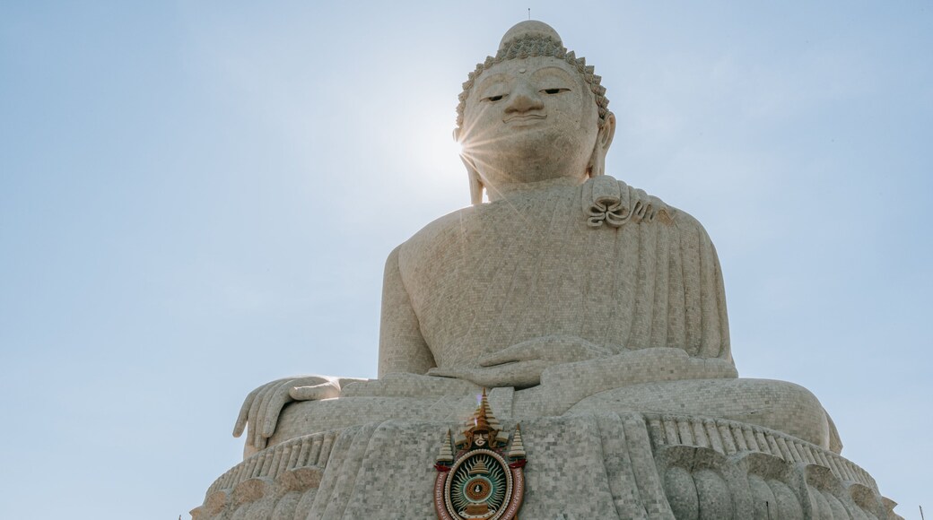 Big Buddha showing a statue or sculpture, a sunset and a monument