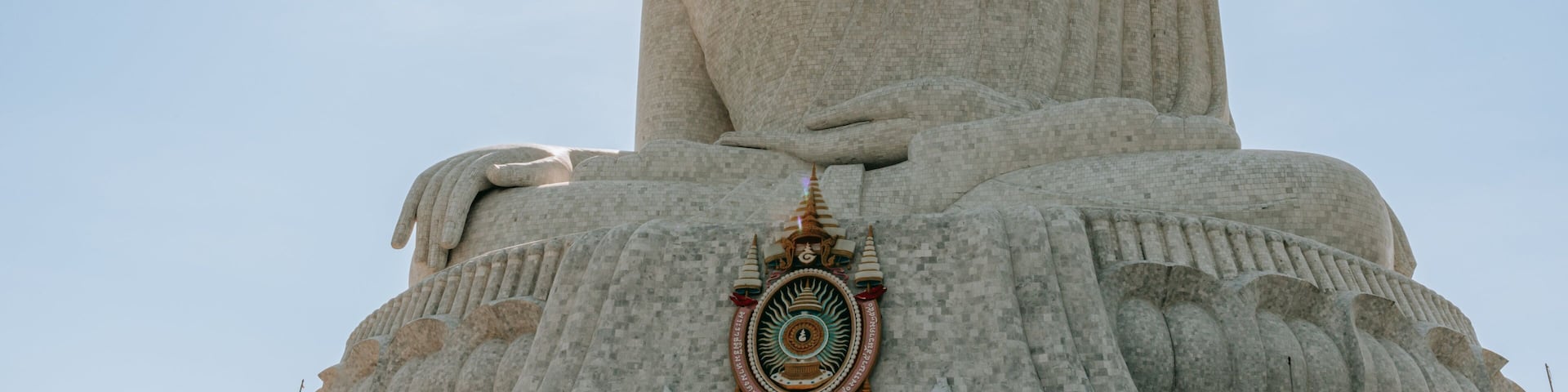 Big Buddha showing a statue or sculpture, a sunset and a monument