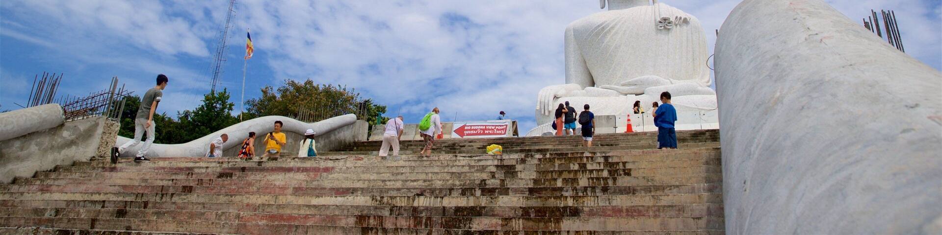 Big Buddha featuring a monument and heritage elements as well as a small group of people
