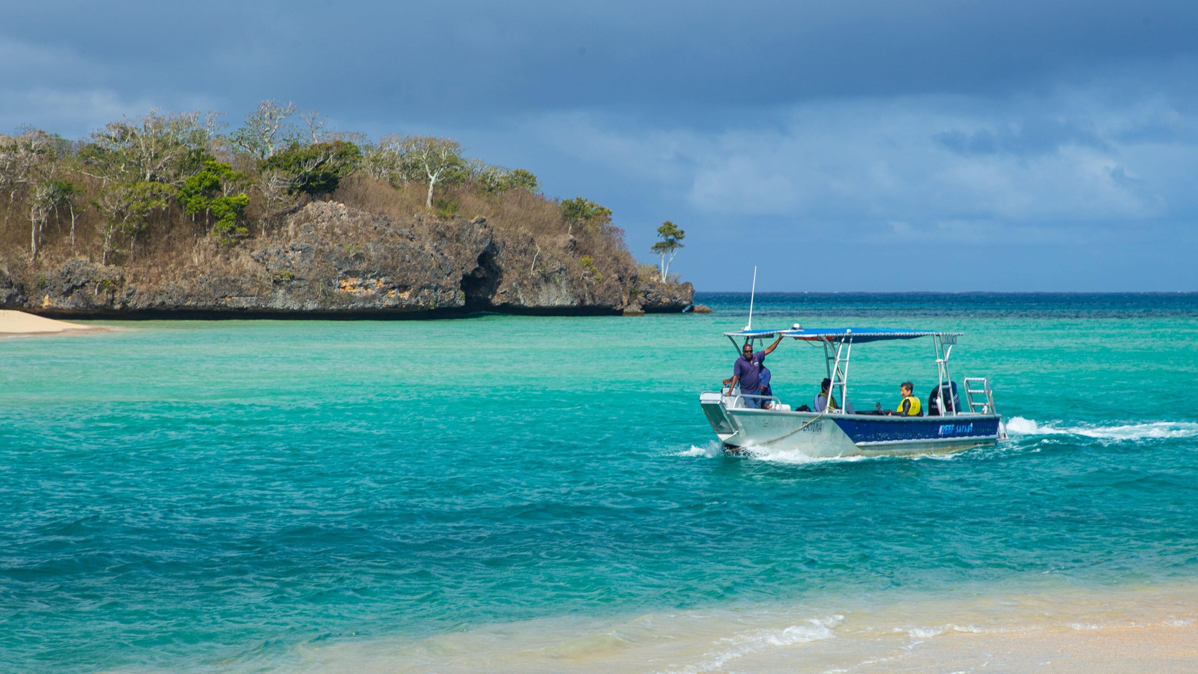 Natadola Beach which includes boating, tropical scenes and general coastal views