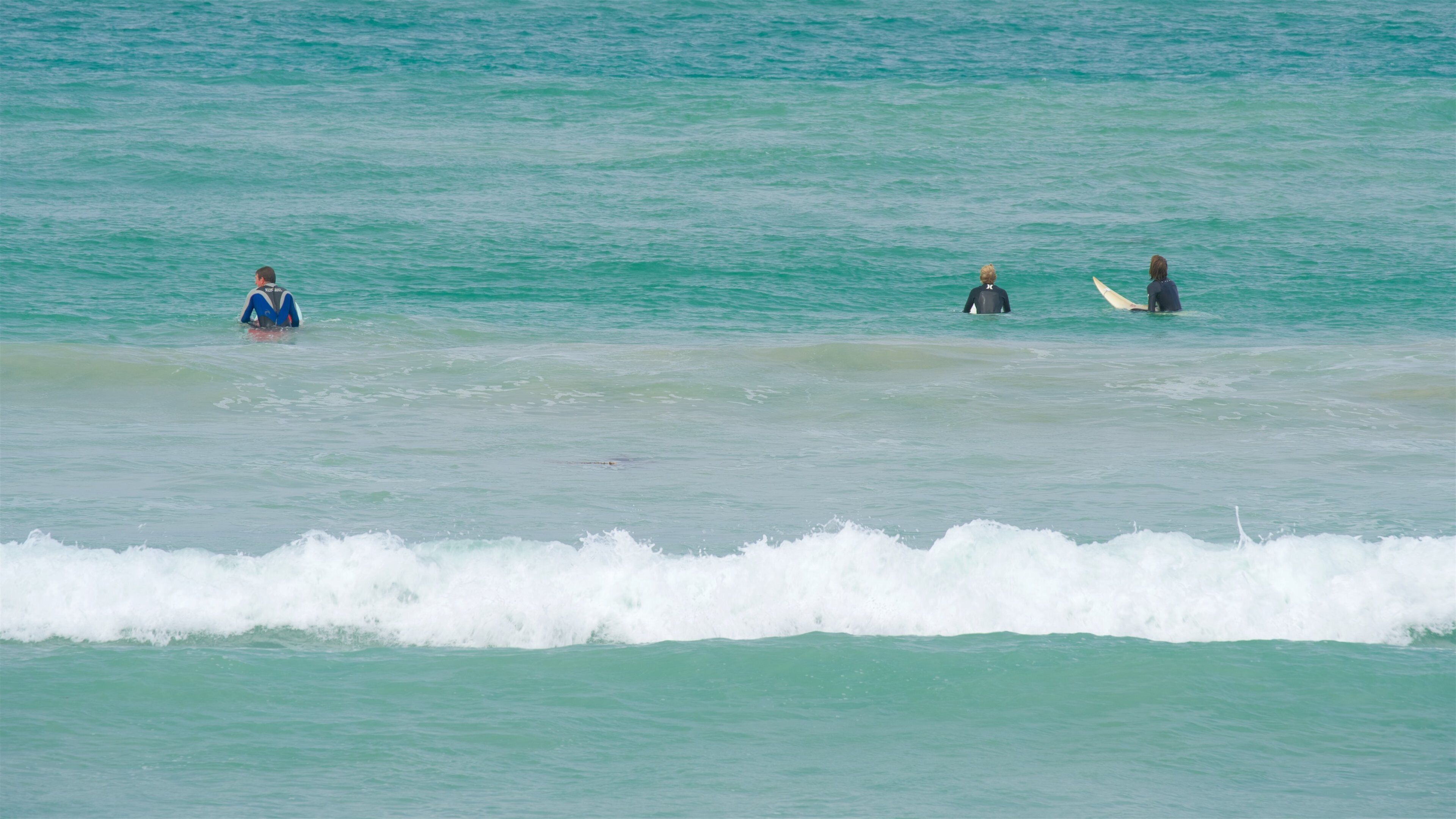 Warrnambool Beach featuring waves and surfing
