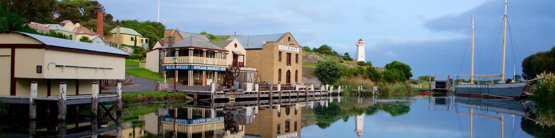 Flagstaff Hill Maritime Village which includes a bay or harbor and a coastal town