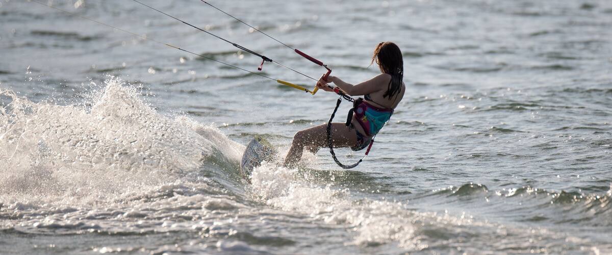 A person windsurfing on the water.