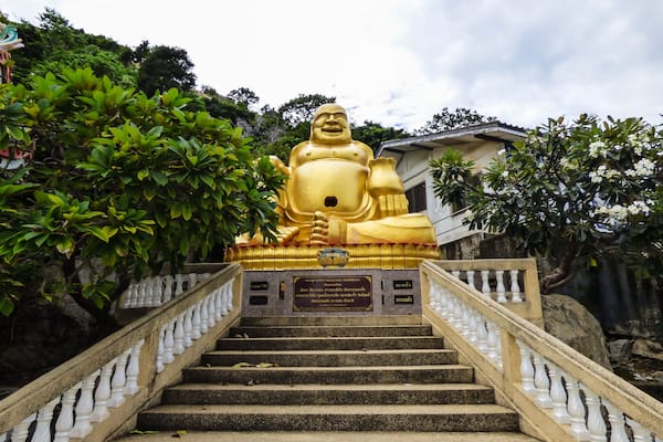 Large laughing Buddha statue at Wat Khao Takiap (buddhist temple) - Hua Hin, Thailand