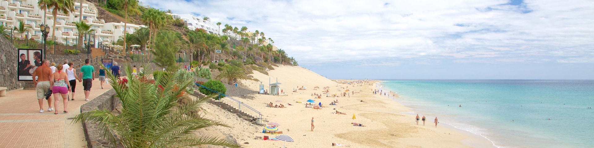 Morro Jable which includes a sandy beach and general coastal views