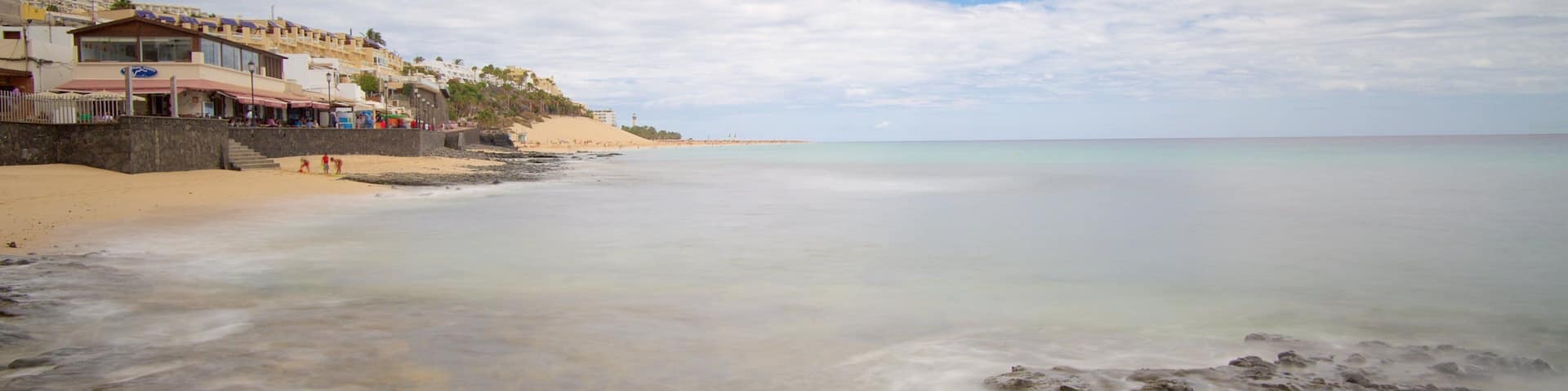 Morro Jable which includes general coastal views and a sandy beach