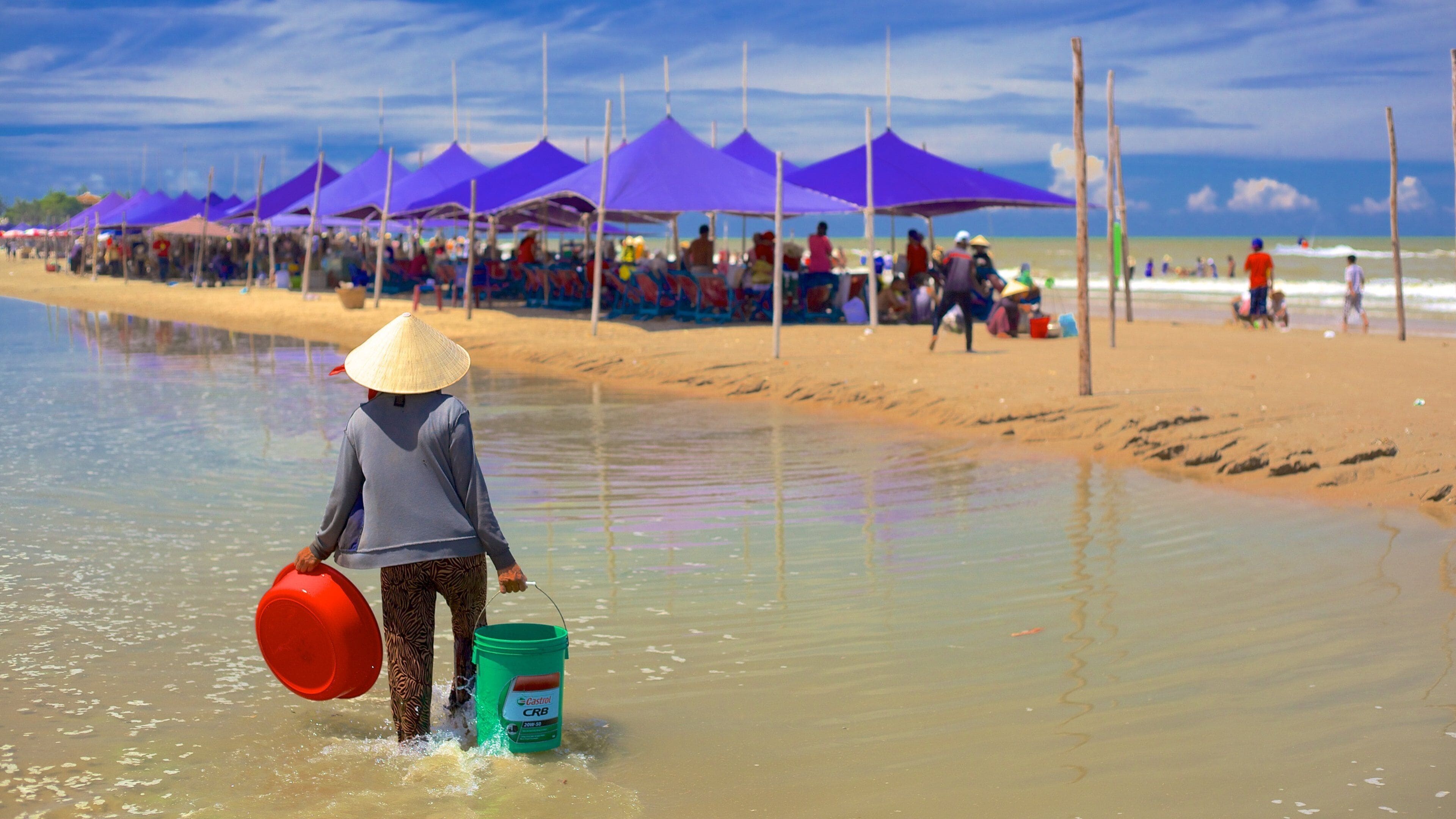 Long Hai Beach featuring general coastal views and a sandy beach as well as an individual femail