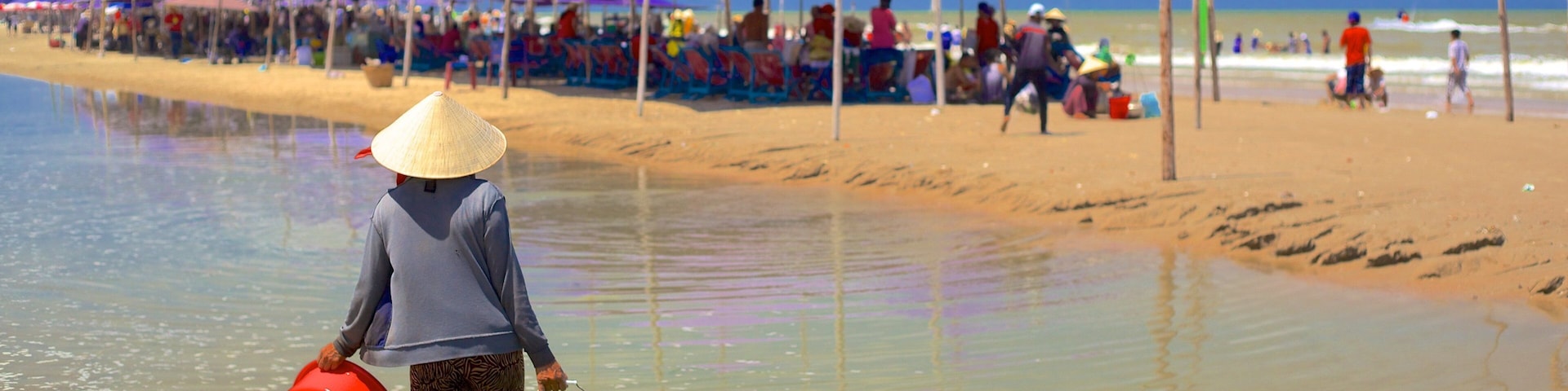 Long Hai Beach featuring general coastal views and a sandy beach as well as an individual femail