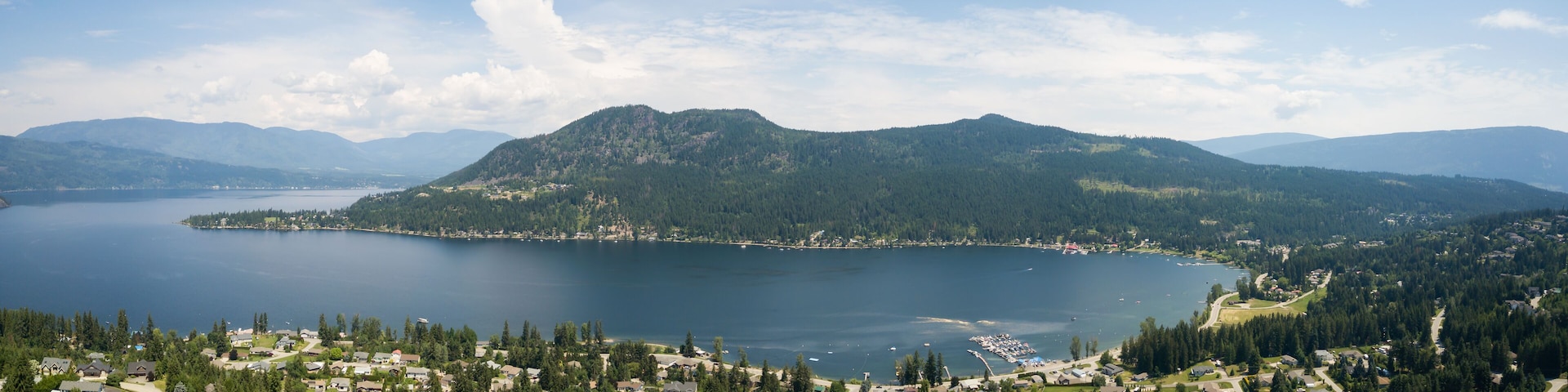 Aerial panoramic view of a little town, Blind Bay, during a vibrant sunny summer day. Taken in the Interior BC, Canada.