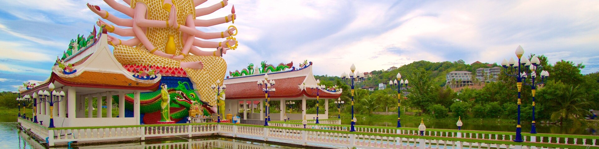 Wat Plai Laem showing religious elements and a statue or sculpture