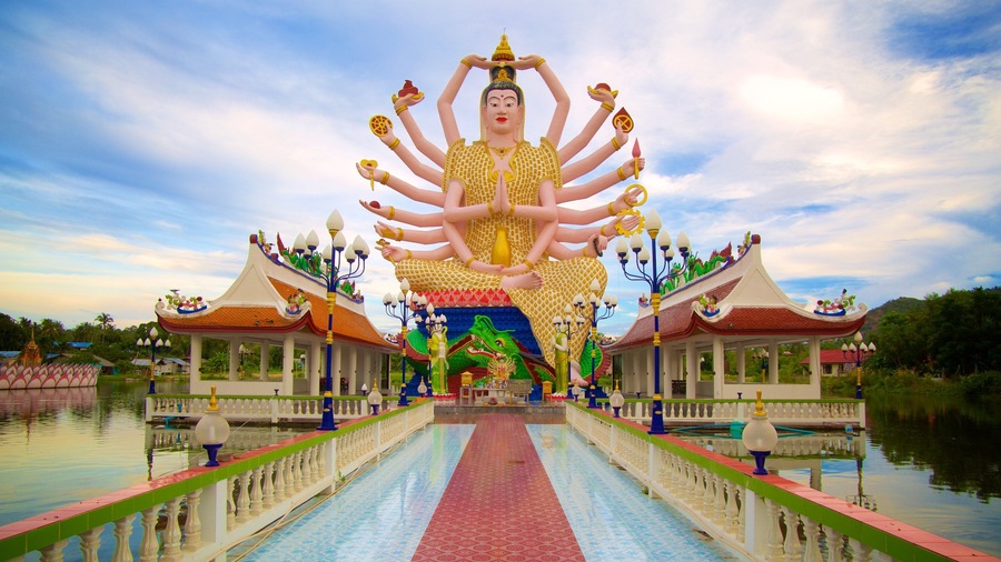 Wat Plai Laem which includes religious aspects and a statue or sculpture