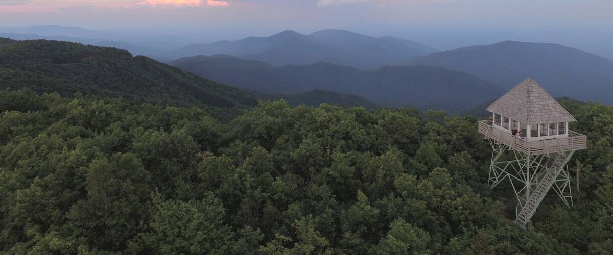 An old fire watch tower that you hike to and enjoy some great views. It is directly off the Blue Ridge Parkway and is definitely a unique destination. You can watch a video about it here: https://www.hdcarolina.com/episode/green-knob-lookout-tower