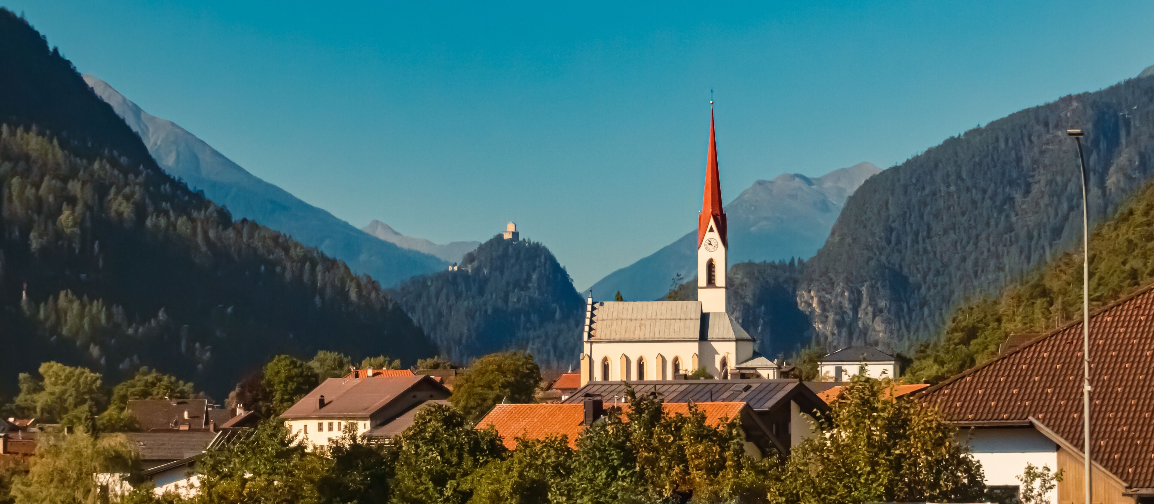 Alpine summer view with a church near Mils, Imst, Tyrol, Austria