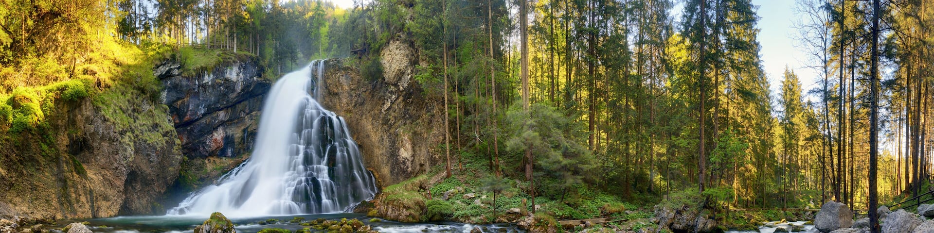 Waterfall in the forest, Austria landscape panorama