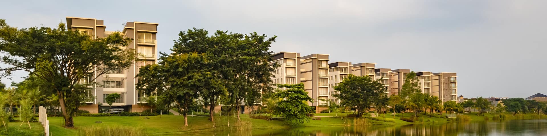 Tangerang, Indonesia - 7th June 2019: Rainbow Springs Condo Villa, a luxury apartment complex, next to a lake, in Gading Serpong residential area. It is an area with high property development.