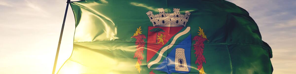 Sao Leopoldo of Brazil flag waving on the top sunrise mist fog