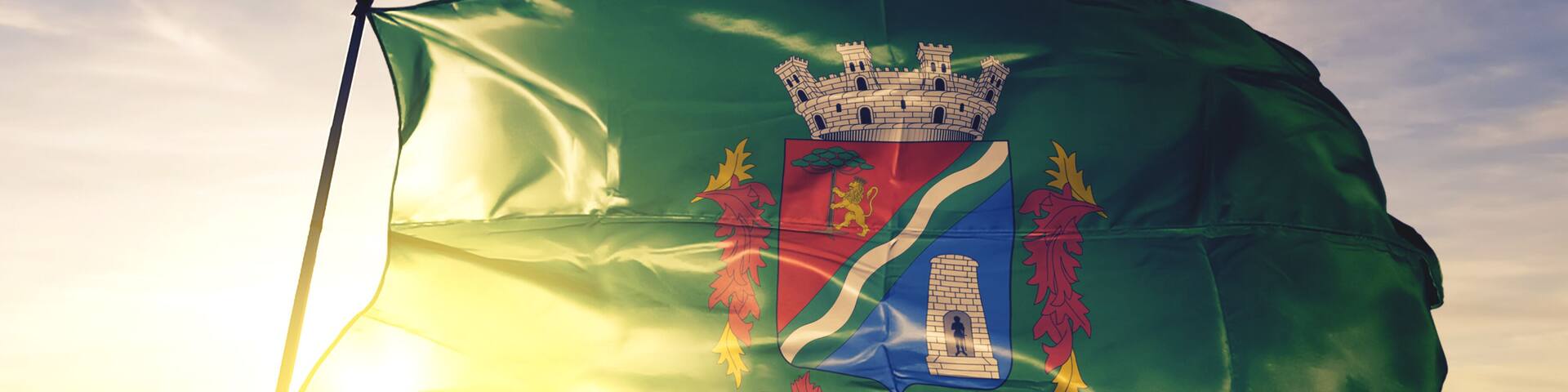 Sao Leopoldo of Brazil flag waving on the top sunrise mist fog