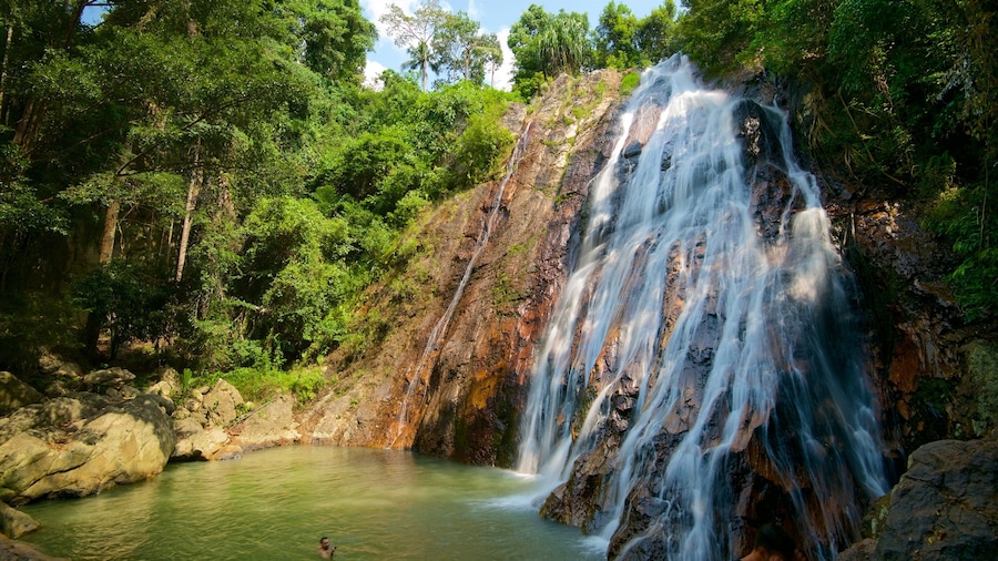 Namuang Waterfall which includes a river or creek, forest scenes and a cascade