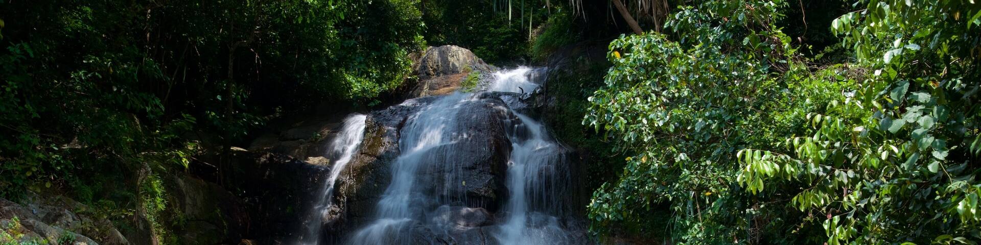 Namuang Waterfall featuring forests and a cascade