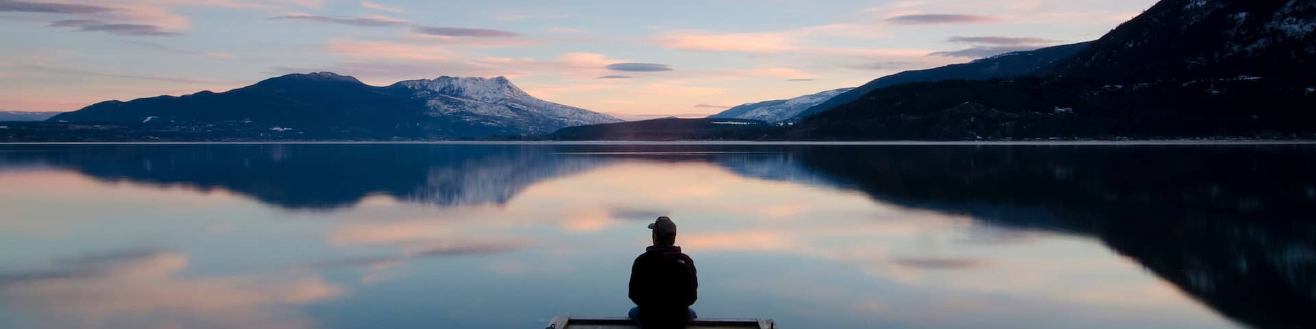Taking in the sunset colours over Shuswap Lake in Sunnybrae, near Salmon Arm, British Columbia, Canada. MR102