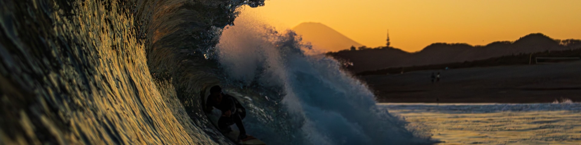 Surfer at Sunset with Mount Fuji