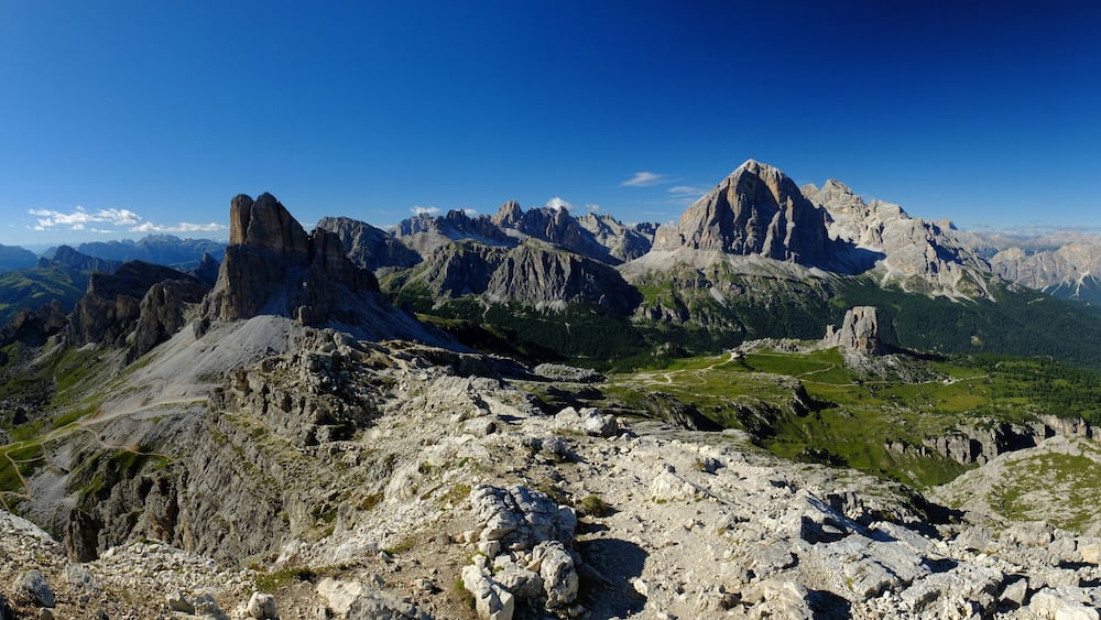 A mountainous landscape with rugged peaks and a winding path.