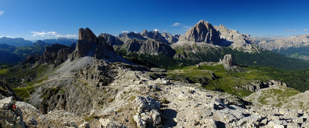 A mountainous landscape with rugged peaks and a winding path.