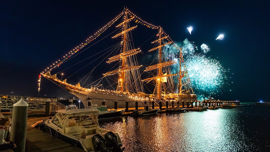 Seaport District featuring heritage elements, a bay or harbor and night scenes