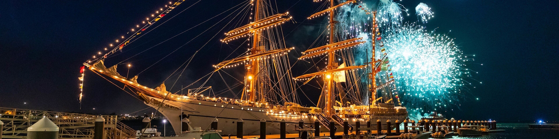 Seaport District featuring heritage elements, a bay or harbor and night scenes