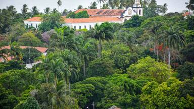 The historic architecture of Olinda in Pernambuco, Brazil with its colonial buildings and cobblestone streets at sunset.