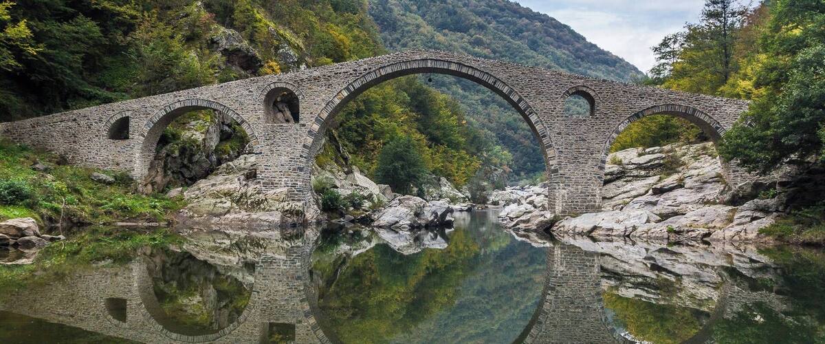 Beautiful old bridge over river Arda in mountains Rodopi close to city Ardino. Very quiet place