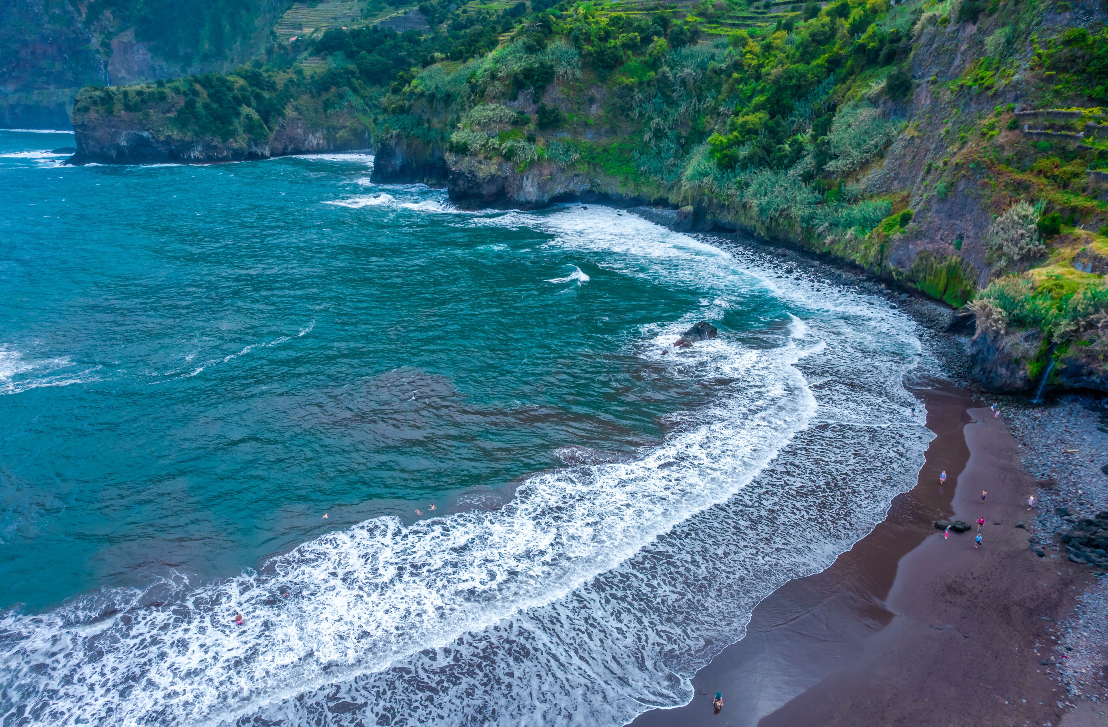 Aerial drone view of black sand beach in Seixal, Madeira island