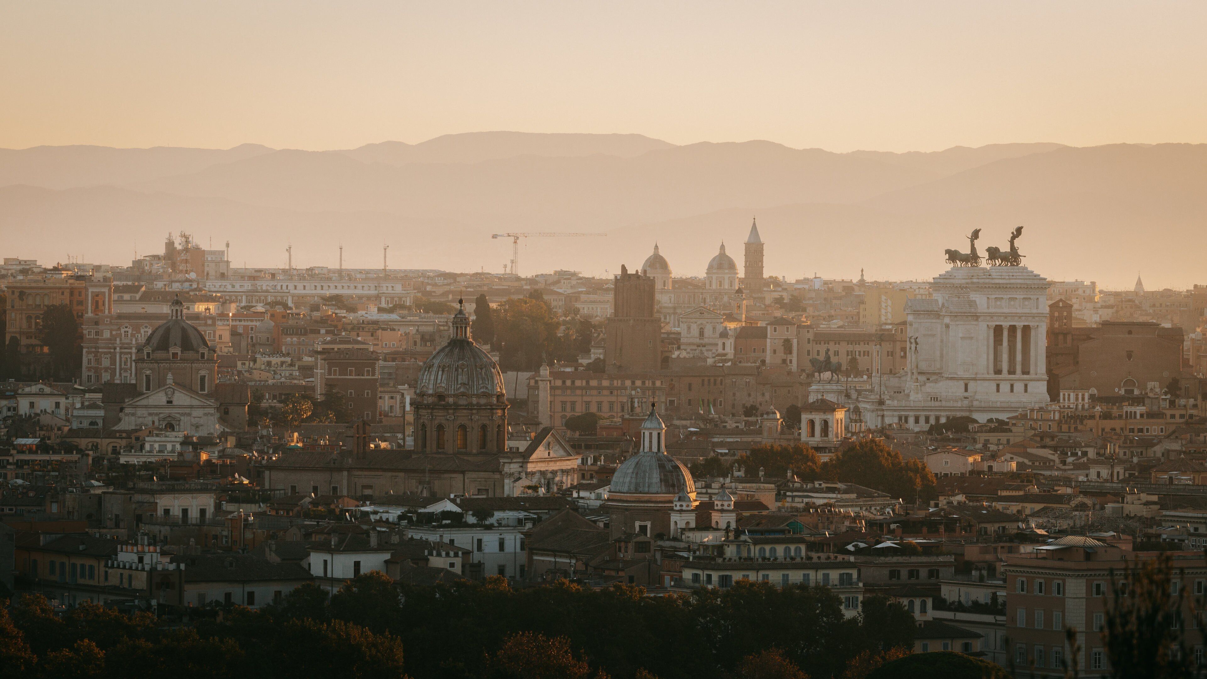 Janiculum Hill which includes landscape views, a city and a sunset