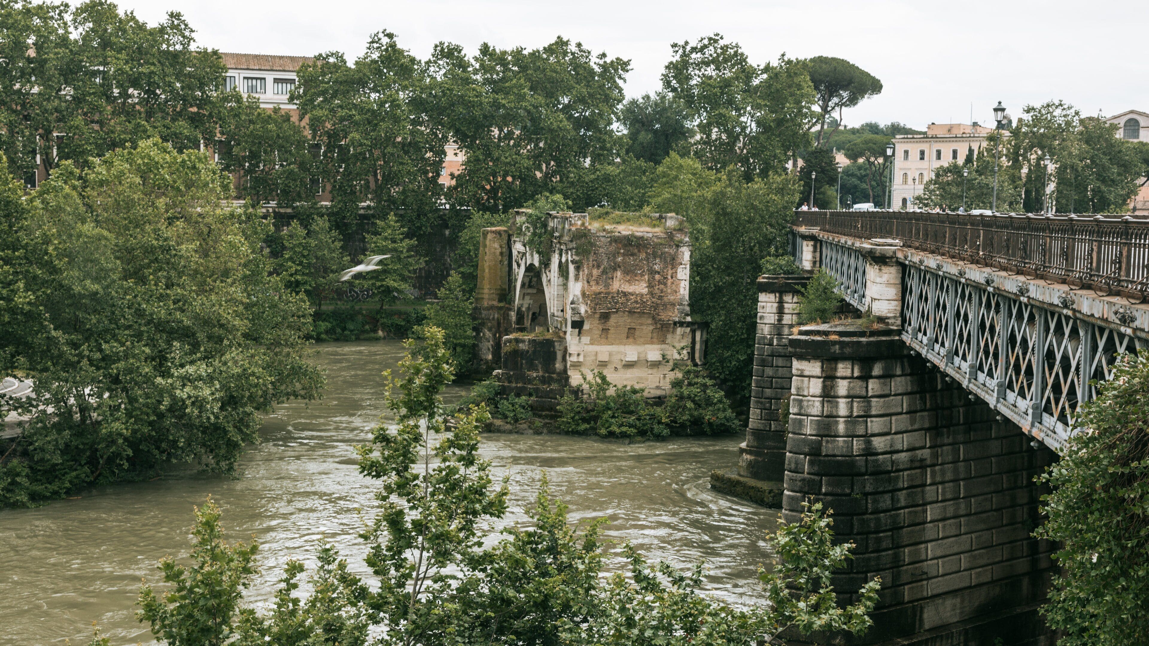 Tiber Island featuring a bridge, a river or creek and heritage elements
