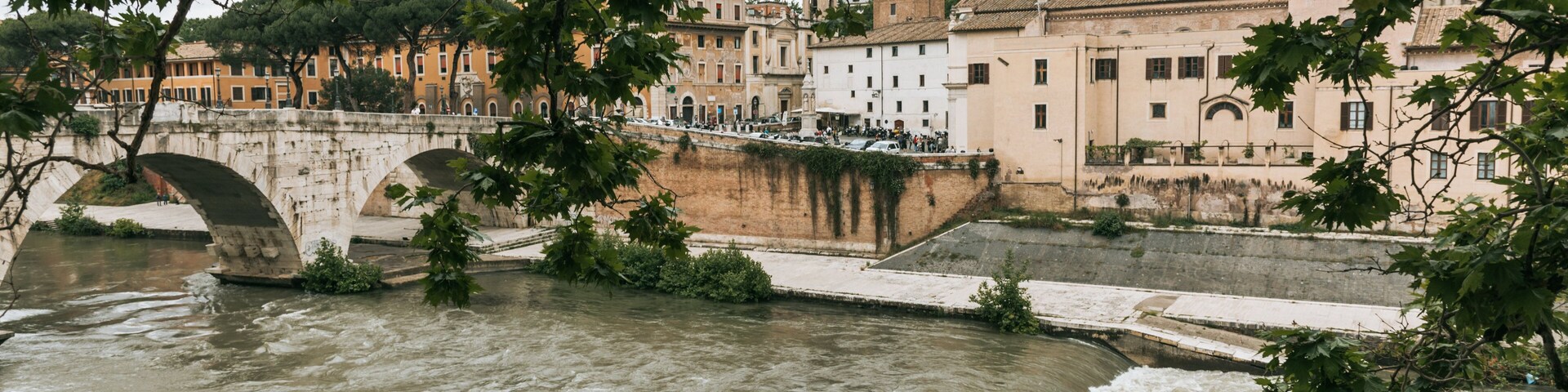 Tiber Island which includes a river or creek and a bridge