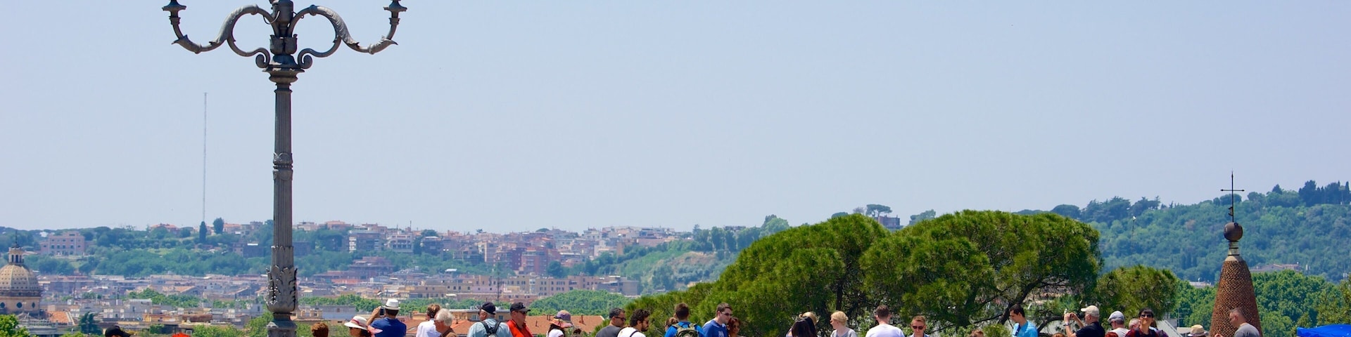 Pincio showing a square or plaza and views as well as a small group of people