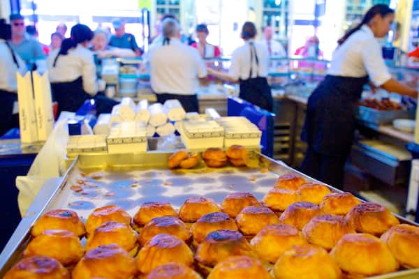 Pasteis de Belem featuring interior views and food