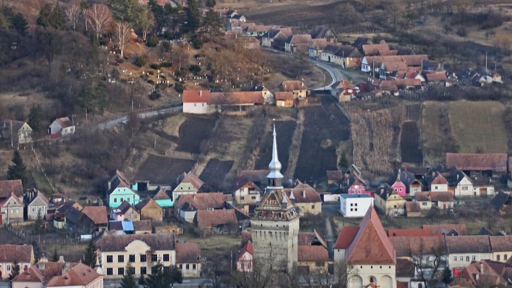 The UNESCO-protected Saxon Fortified Church of Saschiz as seen from the fortress on the hill