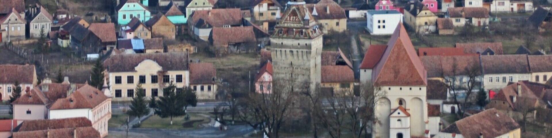 The UNESCO-protected Saxon Fortified Church of Saschiz as seen from the fortress on the hill