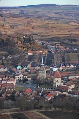The UNESCO-protected Saxon Fortified Church of Saschiz as seen from the fortress on the hill