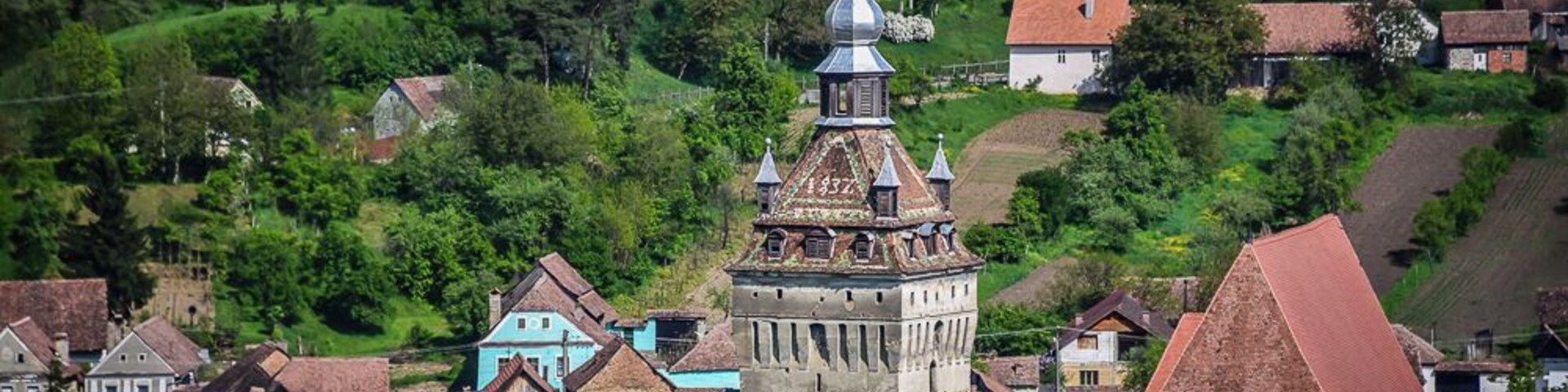 View of the Evangelical church and the Clock Tower in the Village of Saschiz, Romania