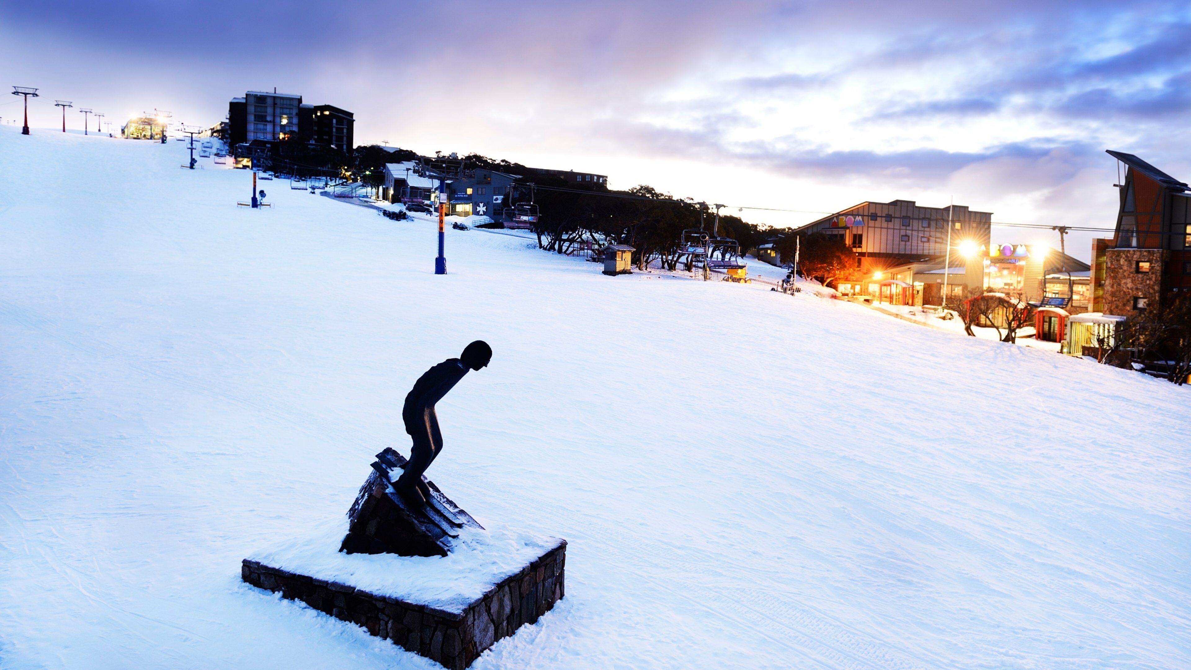 Mt. Buller Ski Slopes which includes a small town or village, snow and night scenes