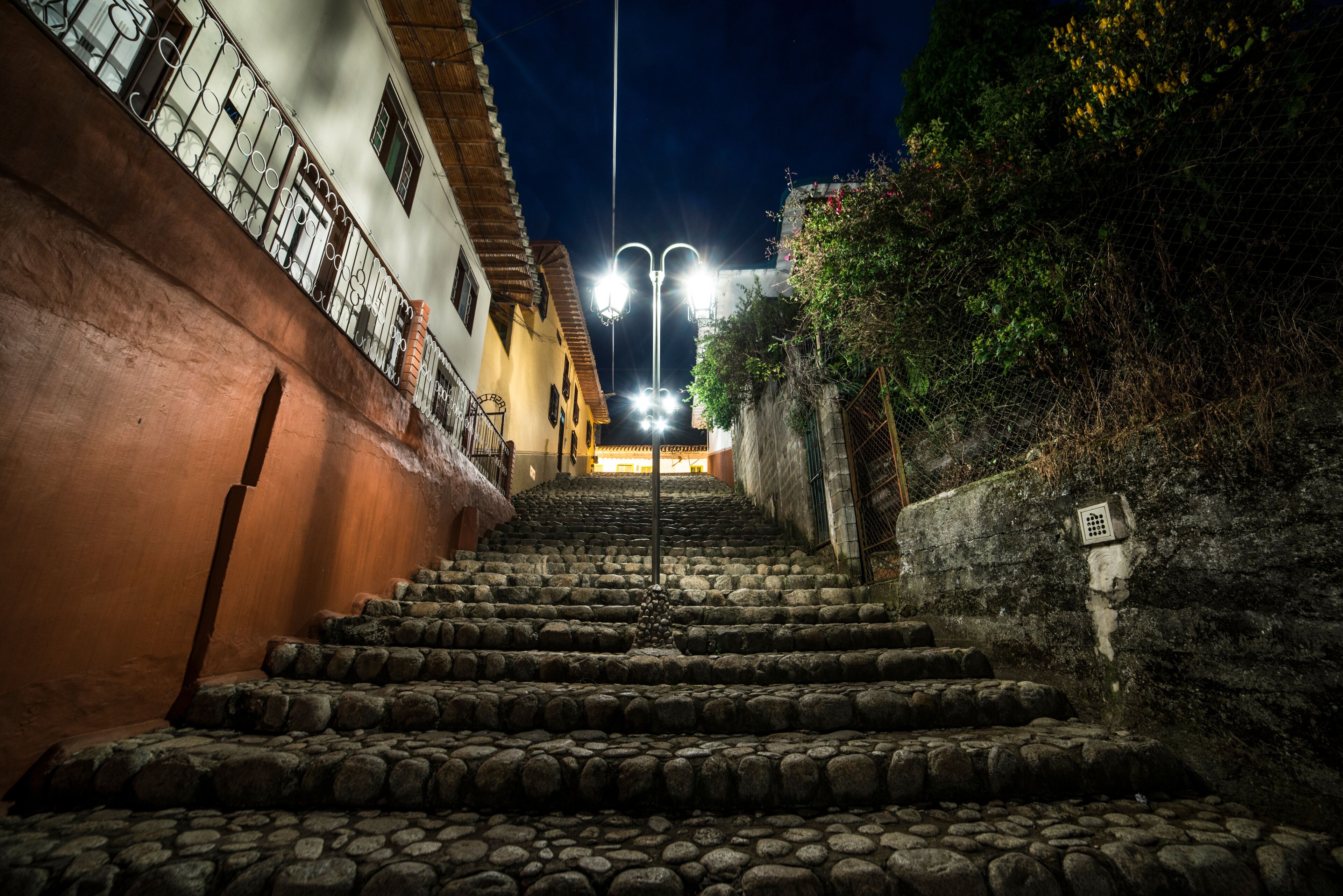 Cobblestone stairs at night with colonial architecture Villa de Leyva Colombia