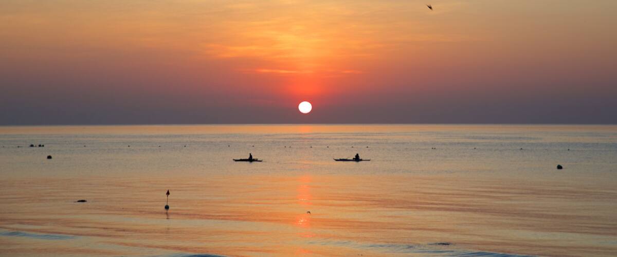 Oslob Beach showing general coastal views and a sunset