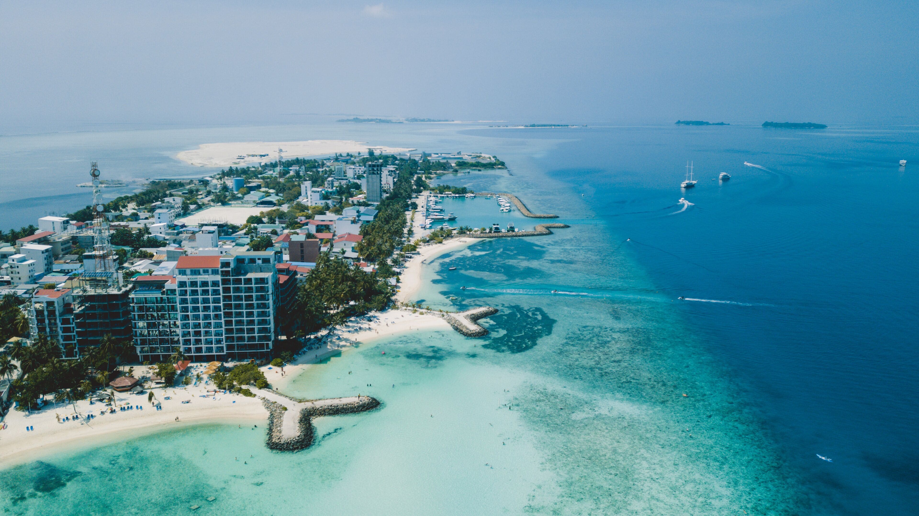 Aerial View to the Maafushi (Kaafu Atoll) Paradise Island with Blue Ocean Water and Paradise Coastline, Maldives